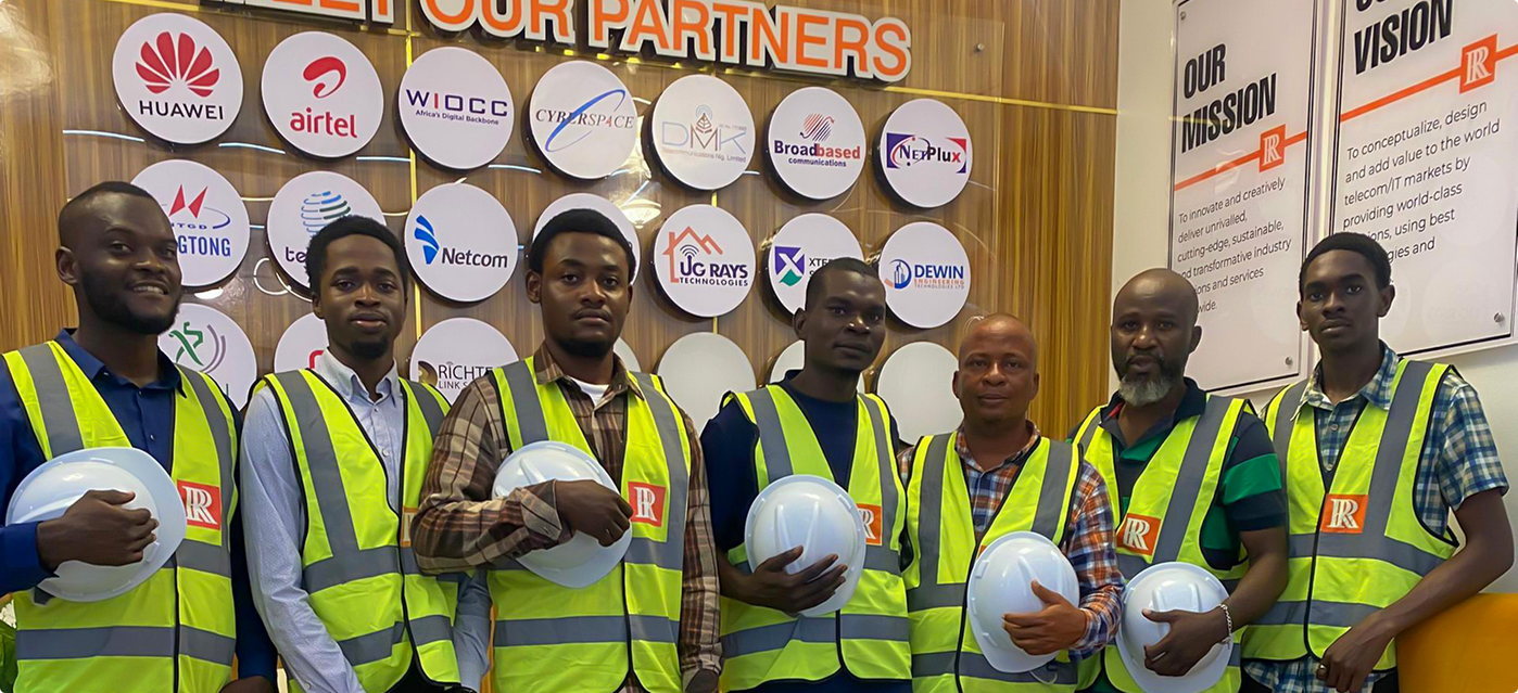Rich & Ray engineers standing by partner wall