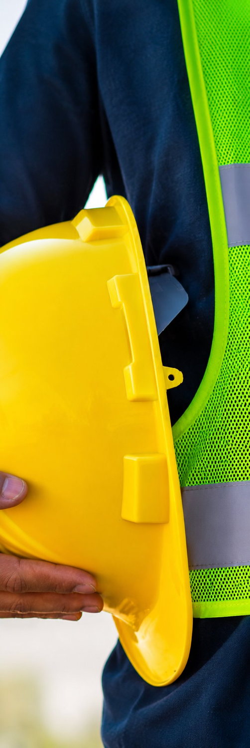 Yellow safety helmet and reflective vest